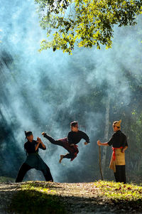 Men in water against sky