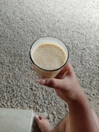 Midsection of woman holding coffee cup