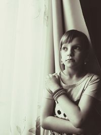 Portrait of a young woman sitting at home