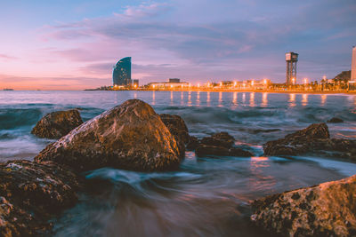 Scenic view of sea against sky at sunset