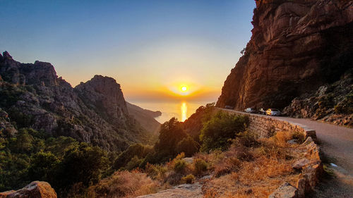 Scenic view of mountains against sky during sunset