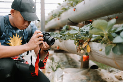 Full length of man photographing