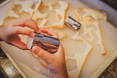 High angle view of hand holding ice cream
