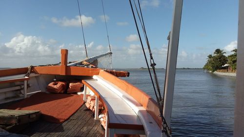 Sailboats on sea against sky