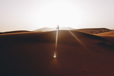 Scenic view of desert against clear sky