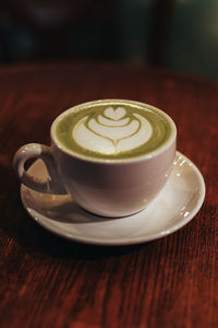 Close-up of cappuccino on table