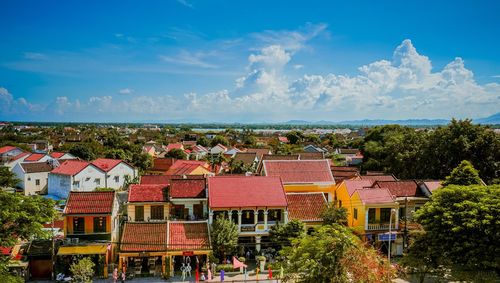 High angle view of townscape against blue sky