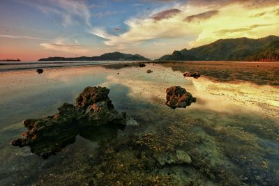 Scenic view of sea against sky at sunset