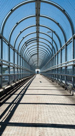 Bridge in city during sunny day