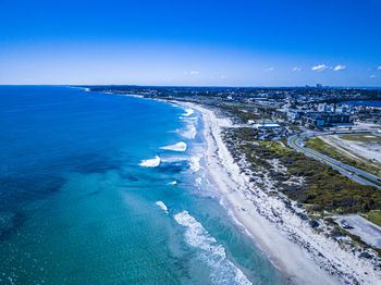 High angle view of sea against blue sky