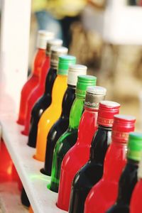 Close-up of multi colored bottles