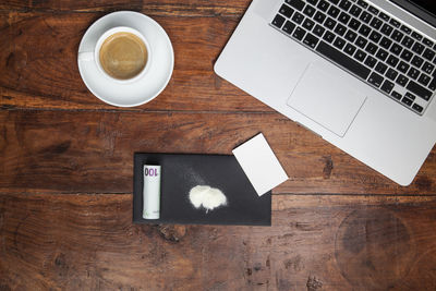 High angle view of coffee cup on table