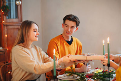 Portrait of smiling young man preparing food