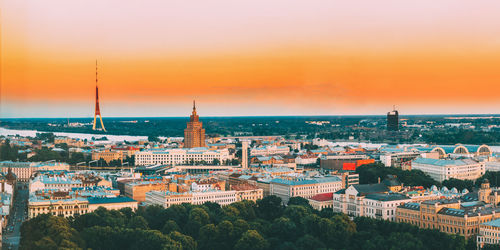 High angle view of buildings against sky during sunset