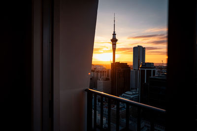 Auckland cityscape against the sky during sunset from a hotel balcony