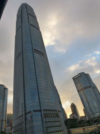 Modern skyscrapers against sky during sunset