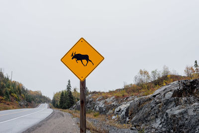 Moose crossing sign along highway in ontario, canada