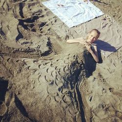 High angle view of woman standing on beach