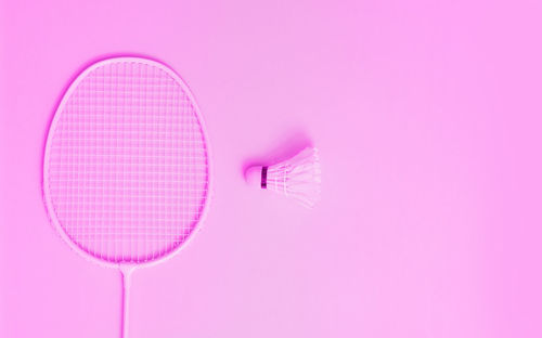 Close-up of pink umbrella against wall