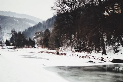 Scenic view of landscape against sky during winter