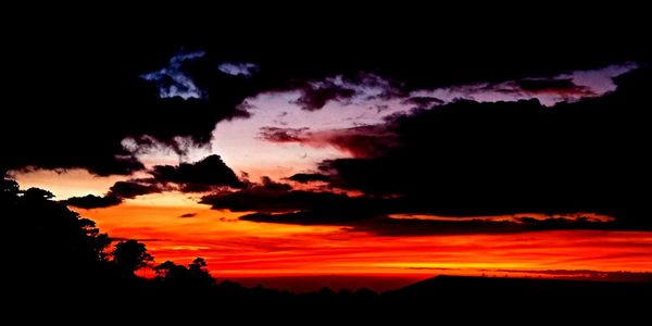 Low angle view of dramatic sky during sunset