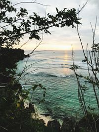 Scenic view of sea against sky at sunset
