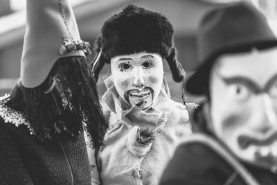 Ancient carnival of sauris. traditional wooden masks. black and white. italy