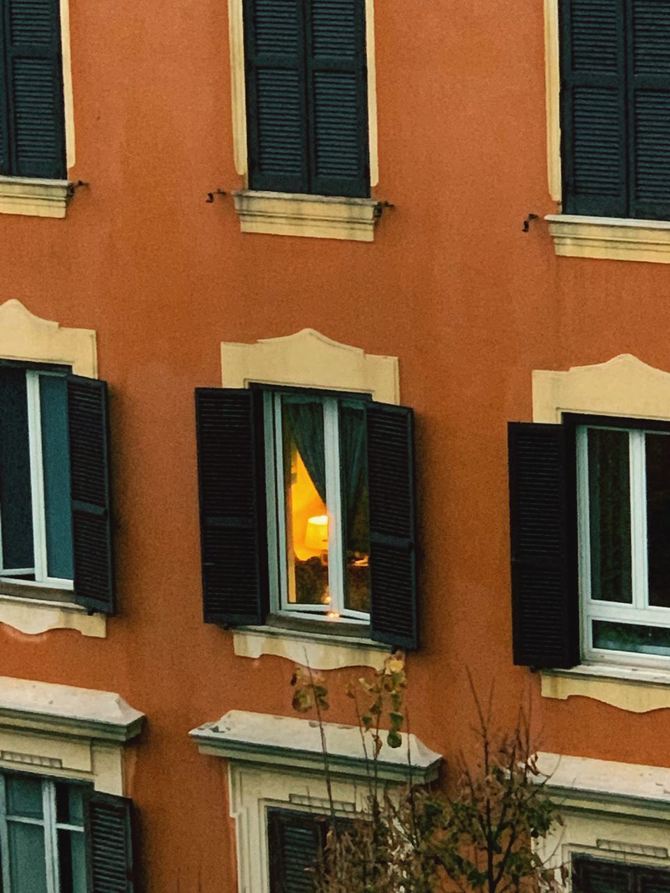 LOW ANGLE VIEW OF ORANGE RESIDENTIAL BUILDING