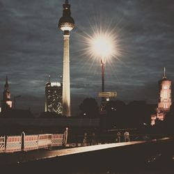 Television tower against cloudy sky