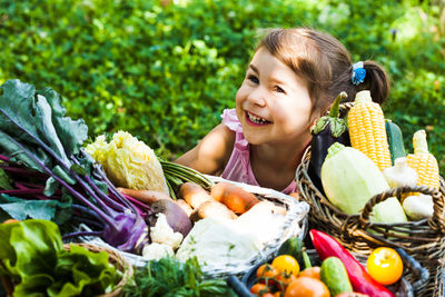 Portrait of smiling woman with vegetables