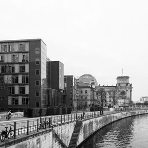 View of buildings in city against clear sky