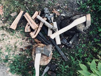 High angle view of wooden logs on field