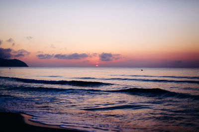 Scenic view of sea against sky at sunset