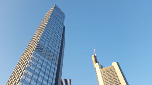 Low angle view of modern buildings against clear sky