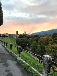 Scenic view of city against sky during sunset