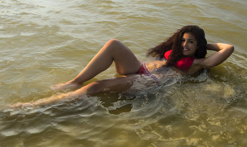 Portrait of young woman in sea