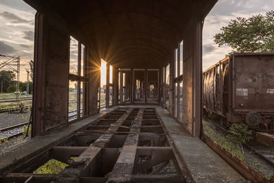 Railroad track amidst train against sky