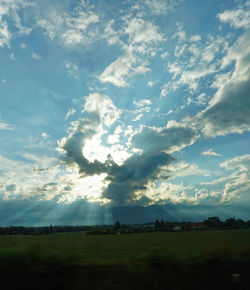 Scenic view of landscape against cloudy sky