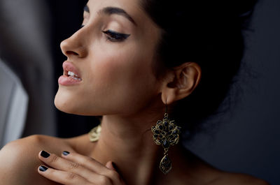 Close-up of beautiful woman looking away