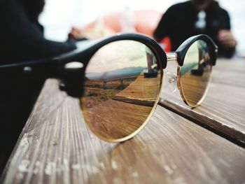 Close-up of sunglasses on glass