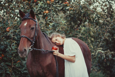 Portrait of a girl with horse