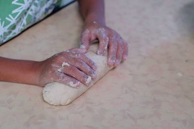 High angle view of person preparing food on table