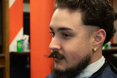 Close-up of thoughtful bearded man looking away