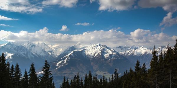 Scenic view of mountains against cloudy sky