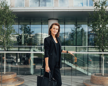 Portrait of businesswoman standing in office