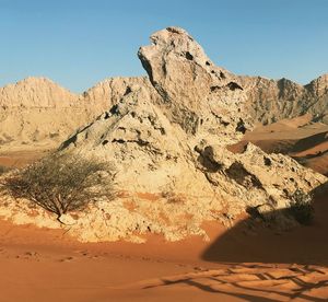 Tranquil view of mountains in desert against clear sky