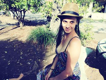 Portrait of beautiful young woman in park