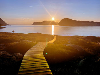 Path to the light, a sunset and a romantic walk in langevågen, norway 