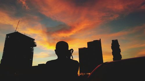 Silhouette of people at sunset