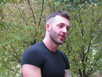 Portrait of young man in forest